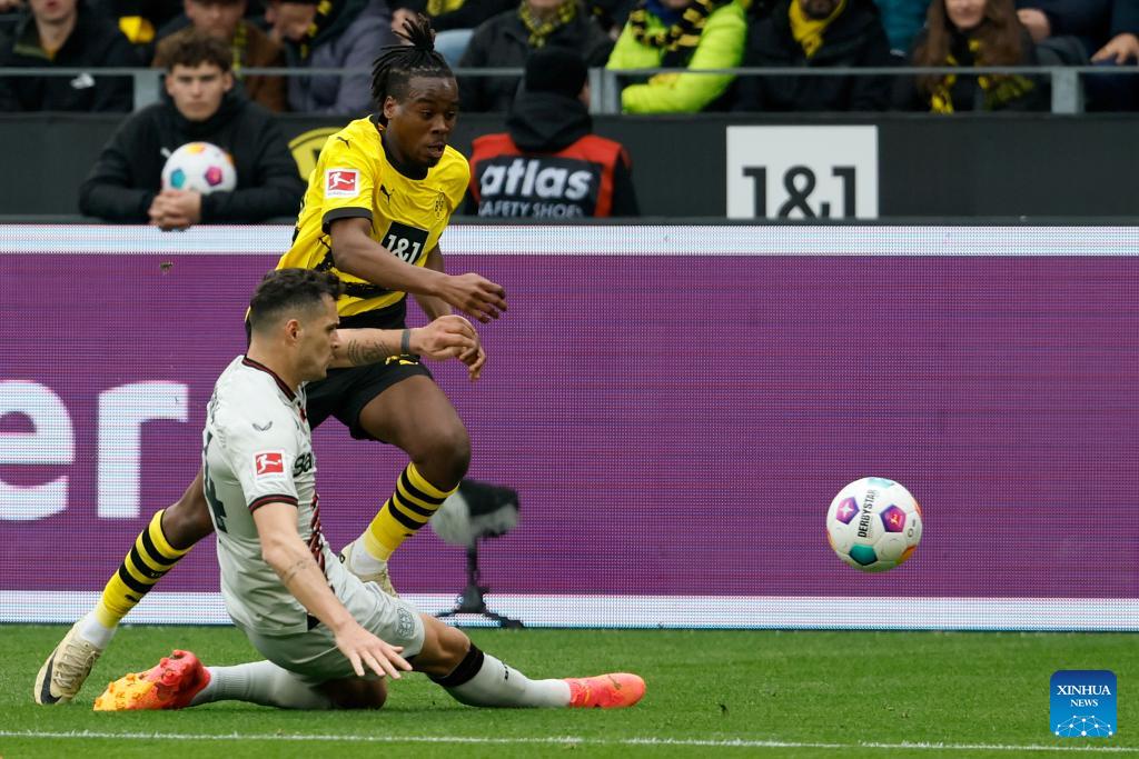 Leverkusen salvage Dortmund draw to stay unbeaten
